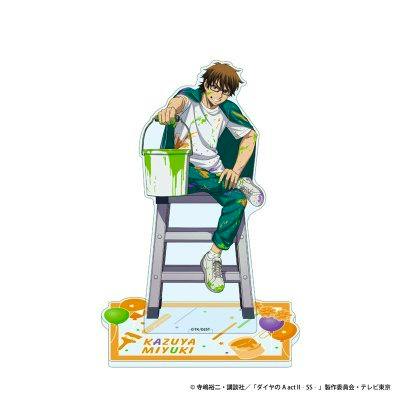 Acrylic stand mockup showing Kazuya Miyuki seated on a ladder holding a paint bucket, on a graffiti-style base with his name.
