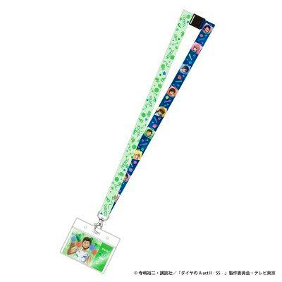 Lanyard (neck strap) with green and blue patterned fabric and an attached festival-invitation style card showing character artwork.