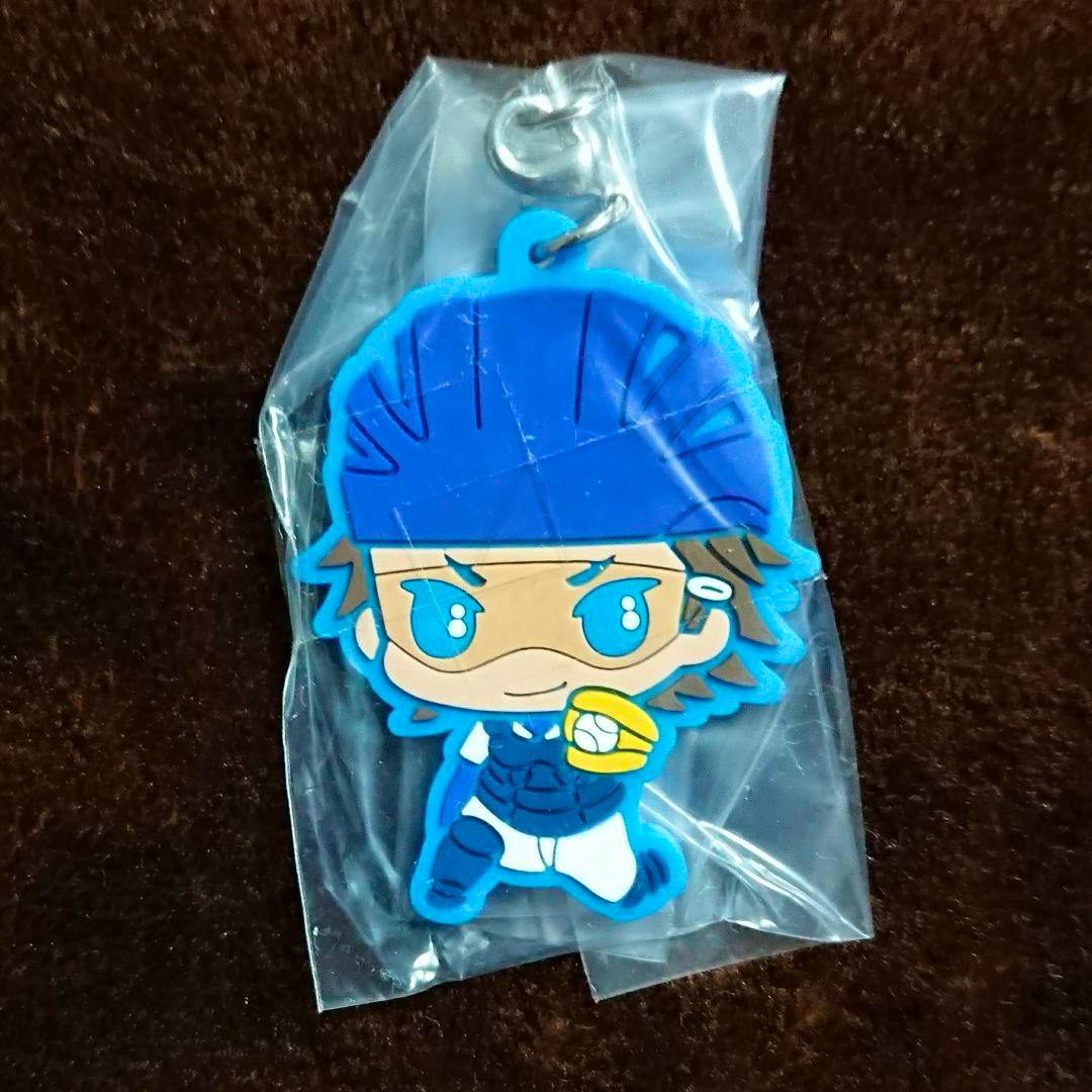 Front view of the rubber capsule mascot keychain of Miyuki Kazuya in plastic packaging, showing the character wearing blue gear.