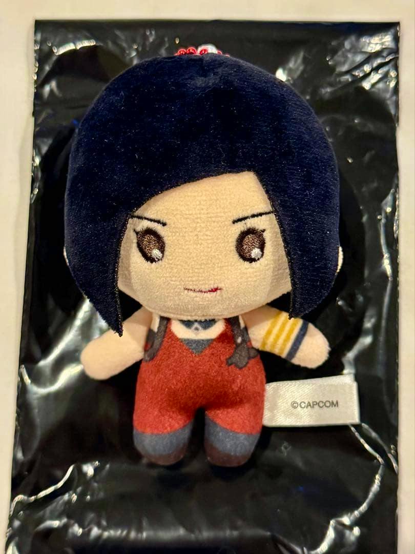 Front view of the Ada collectible plush keychain from Biohazard (Resident Evil) showing the character in a red outfit and tag.