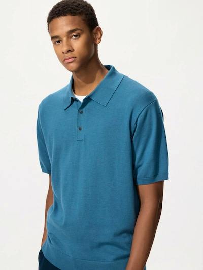 Male model wearing a teal short-sleeve washable knit polo sweater, front view.