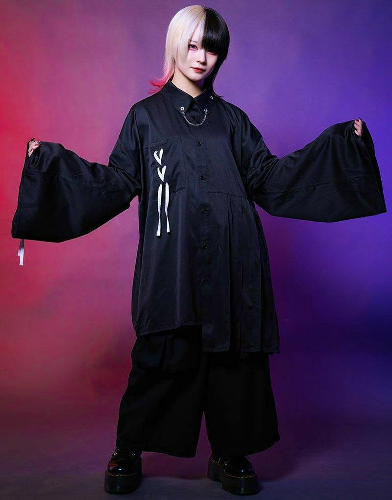 Model wearing the black AdaNous men's polyester lace-up shirt with wide sleeves.