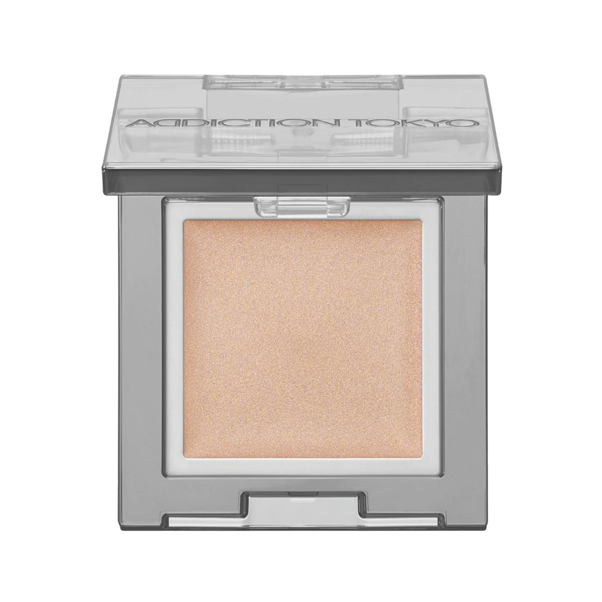 Photo of the Addiction The Single Eyeshadow Pearl refill showing a square pan of light shimmery beige eyeshadow in a clear compact.