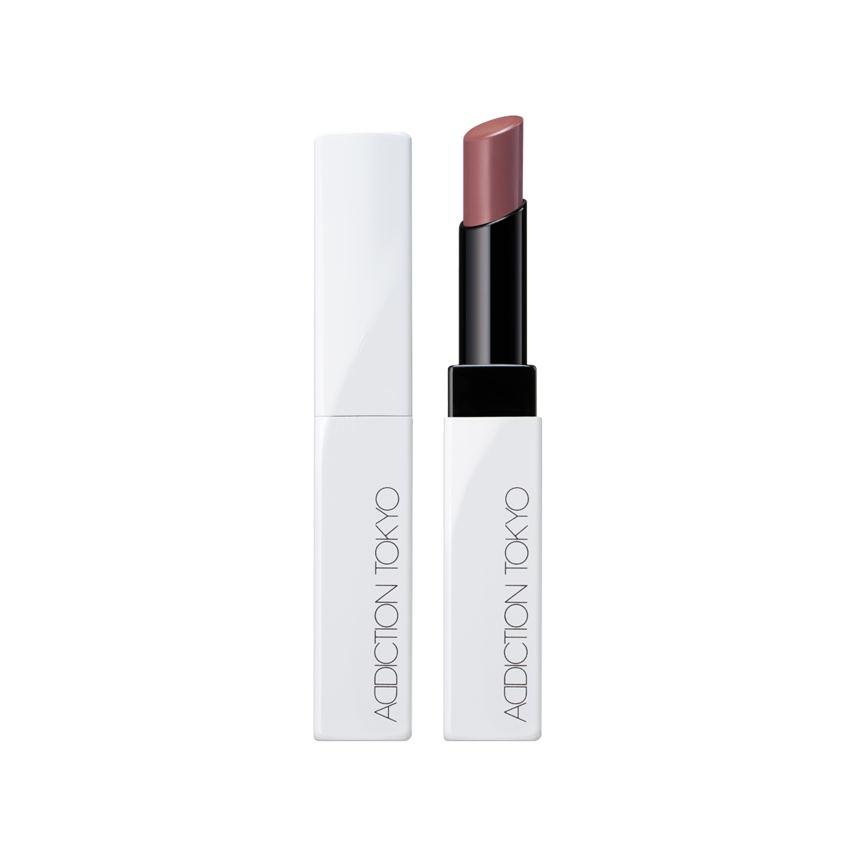 Open white ADDICTION TOKYO lip balm tube with the exposed balm stick visible.
