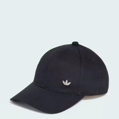 Black baseball cap showing the front and brim with a small tonal metal trefoil logo on the front panel.