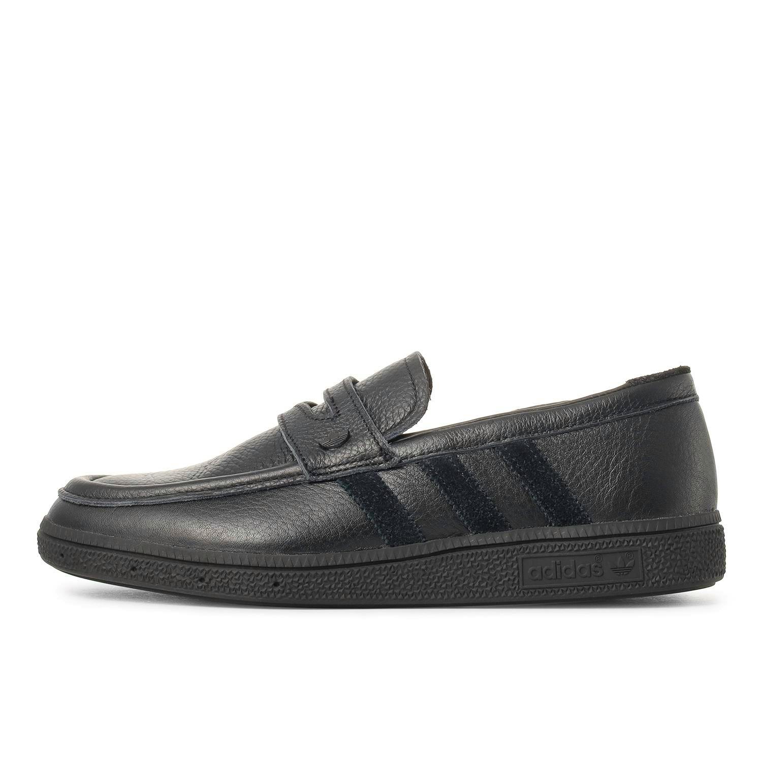 Side view of a black leather HANDBALL SPEZIAL LOAFER showing the profile, strap detail, and sole.