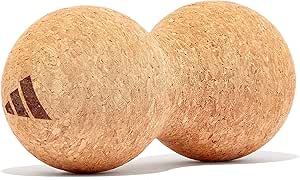 Two cork-textured adidas massage balls shown side by side with the adidas logo visible on one ball.