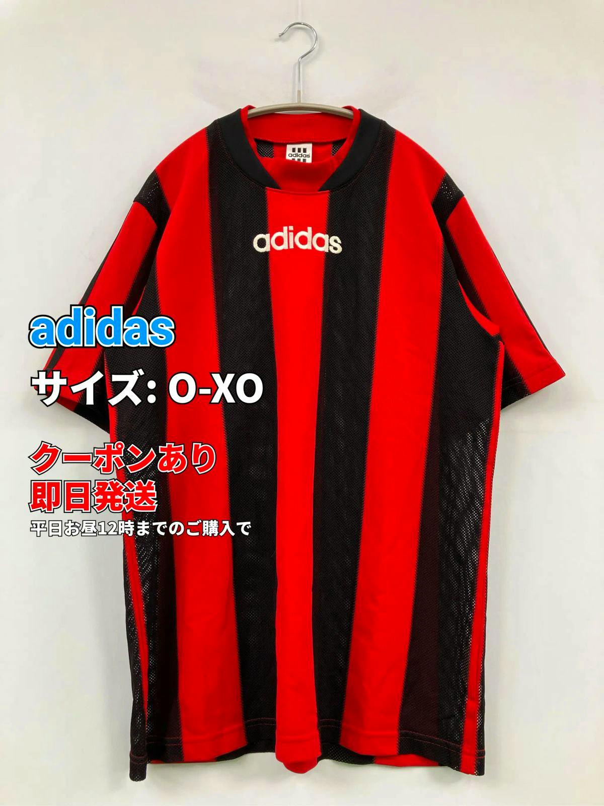 Red and black vertically striped adidas men's short-sleeve jersey hanging on a hanger against a white background.