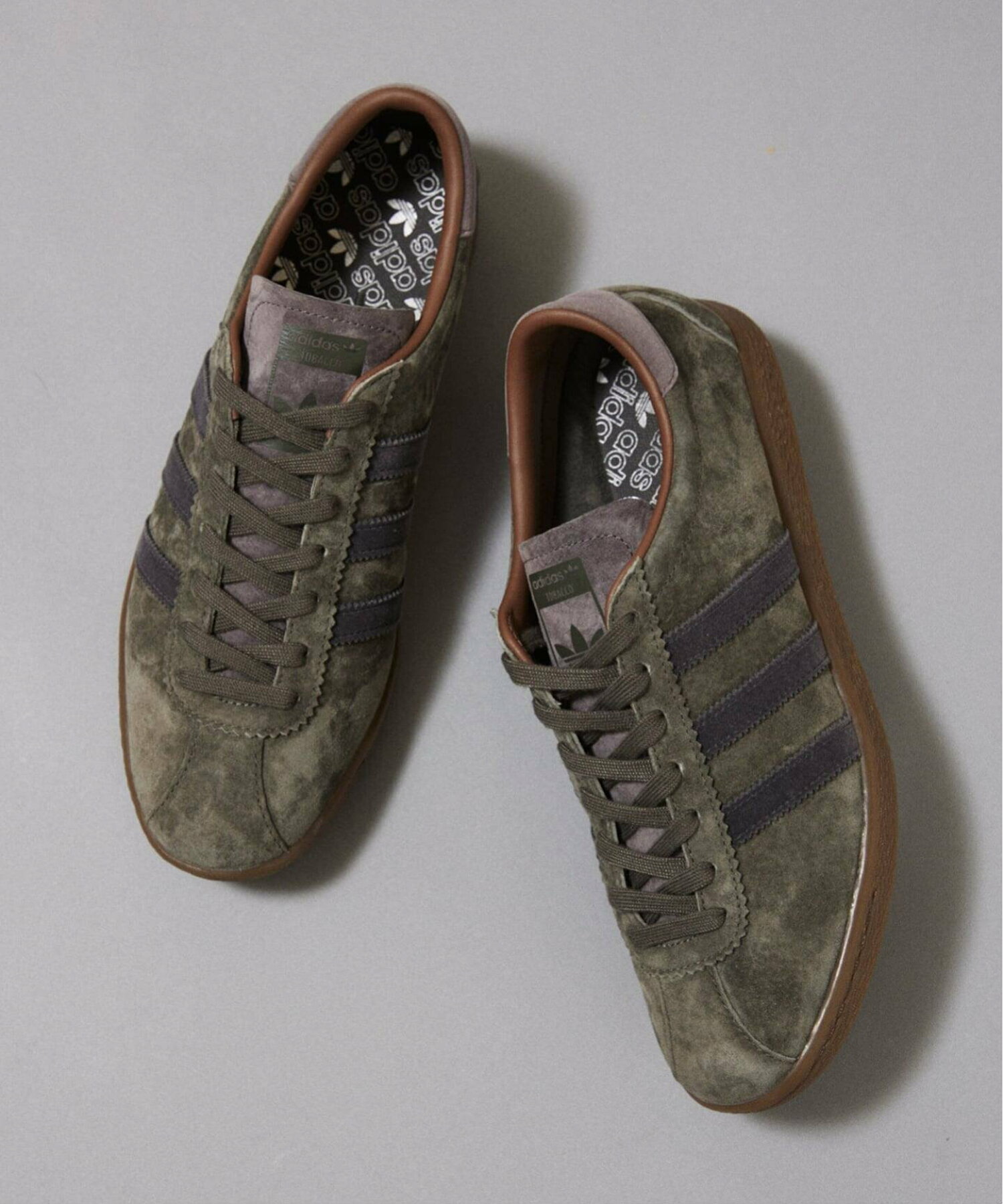 Top-down photo of the adidas Originals suede TOBACCO shoes on a neutral background.