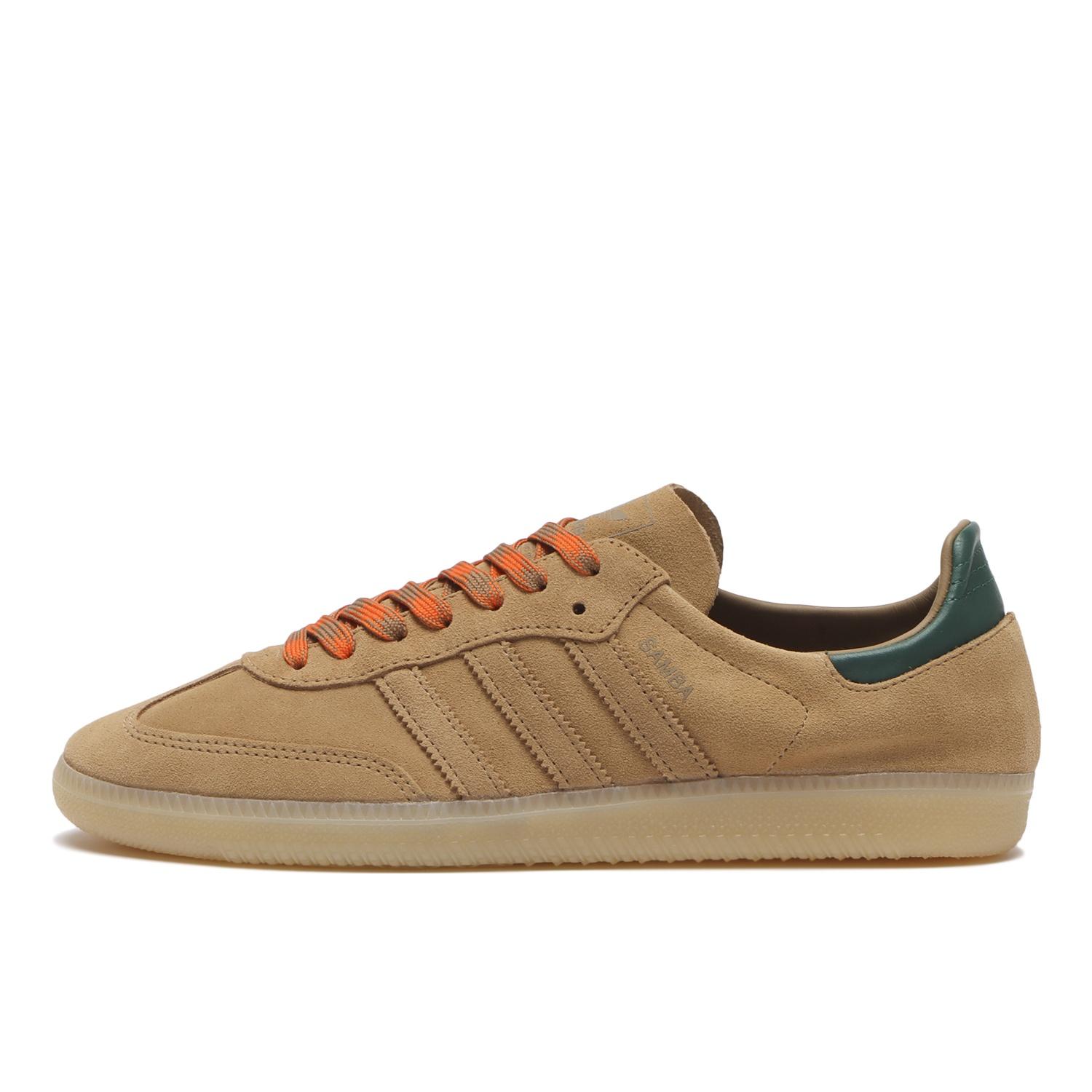 Side view of a tan SAMBA DECON canvas sneaker with orange laces and a gum sole.