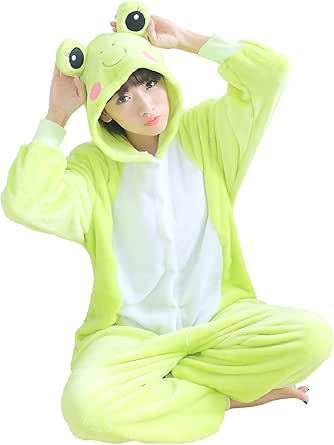 Model wearing a green frog kigurumi pajama with a white belly and a hood featuring frog eyes, seated cross-legged.