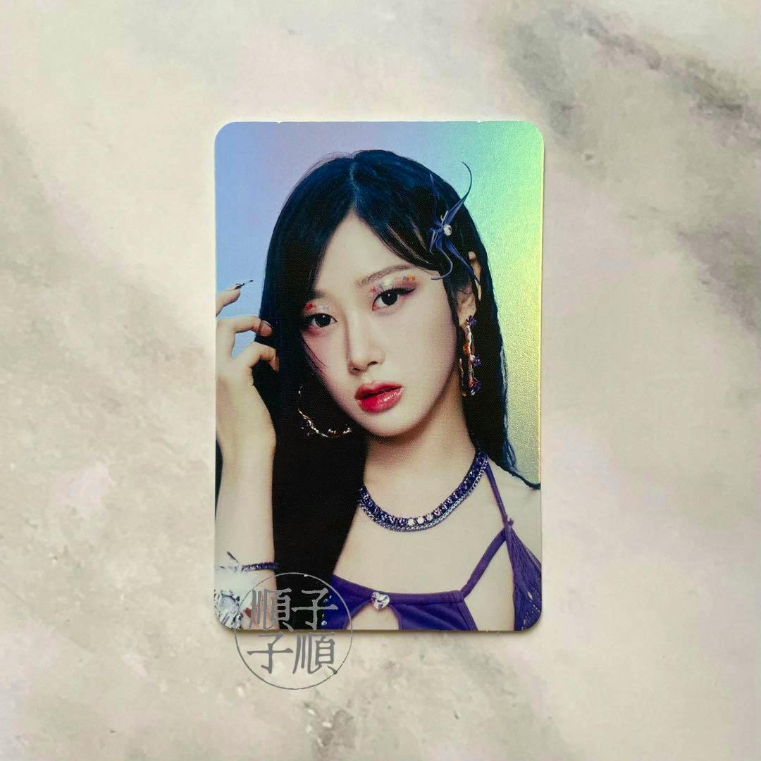Holographic photocard for “Better Things” showing a portrait of a woman wearing a purple top and necklace.