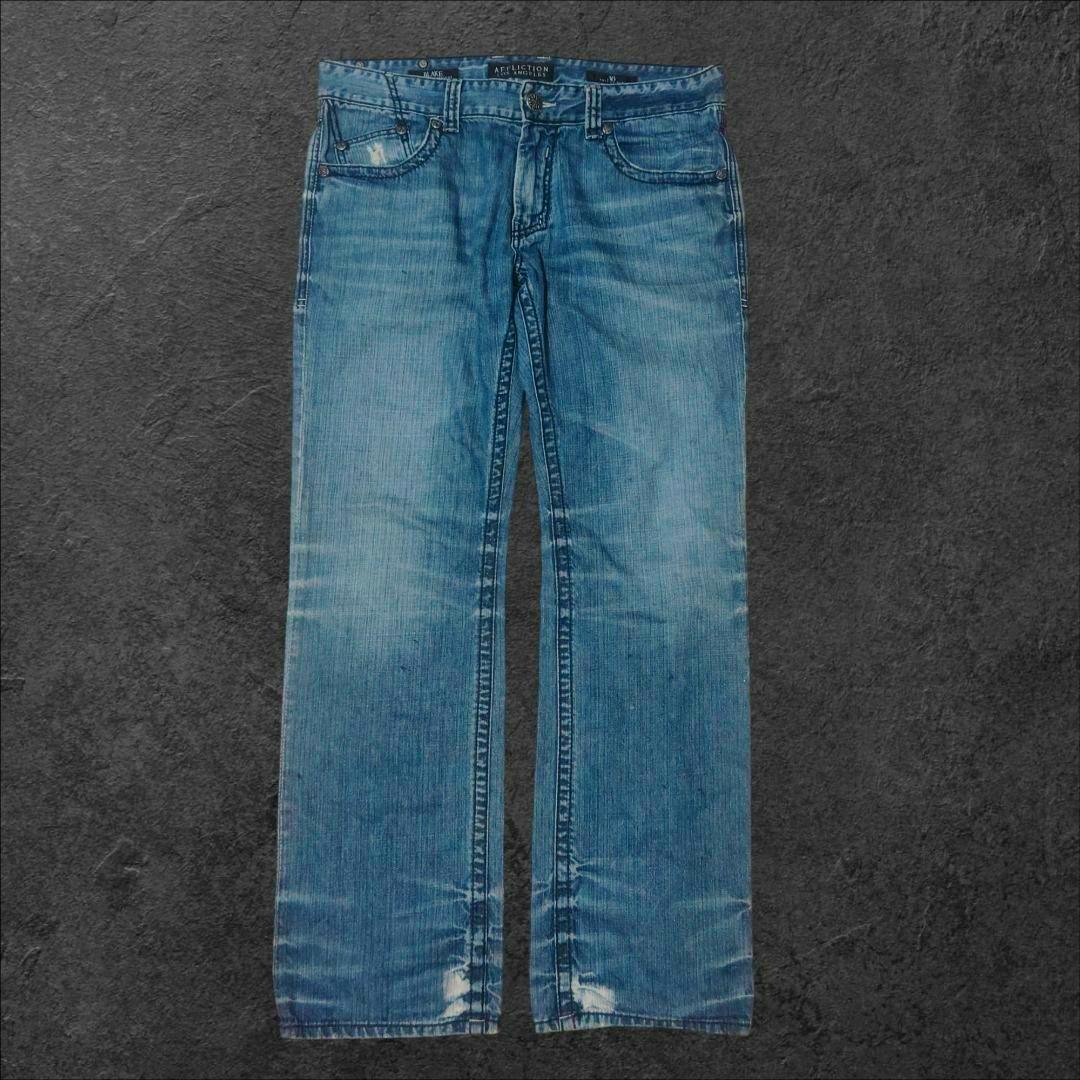 Front view of light-blue AFFLICTION straight denim pants laid flat showing faded wash and slight distressing.