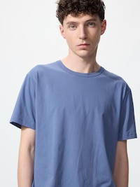 Male model wearing a blue crew-neck T-shirt (front upper-body view).