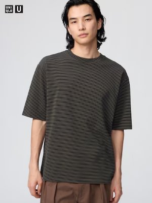 A model wearing an oversized short-sleeve striped T-shirt shown from the front.