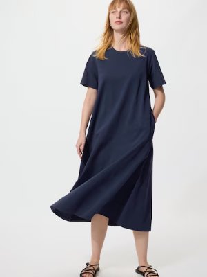 Woman wearing the Airism cotton T dress in navy against a white background.