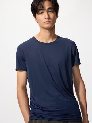 Male model wearing a navy Airism crew-neck men's T-shirt, front view.