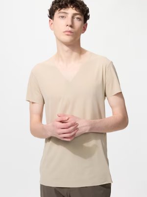 Male model wearing a beige V-neck short-sleeve T-shirt.