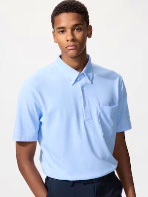 Male model wearing a light blue short-sleeve button-down polo shirt.