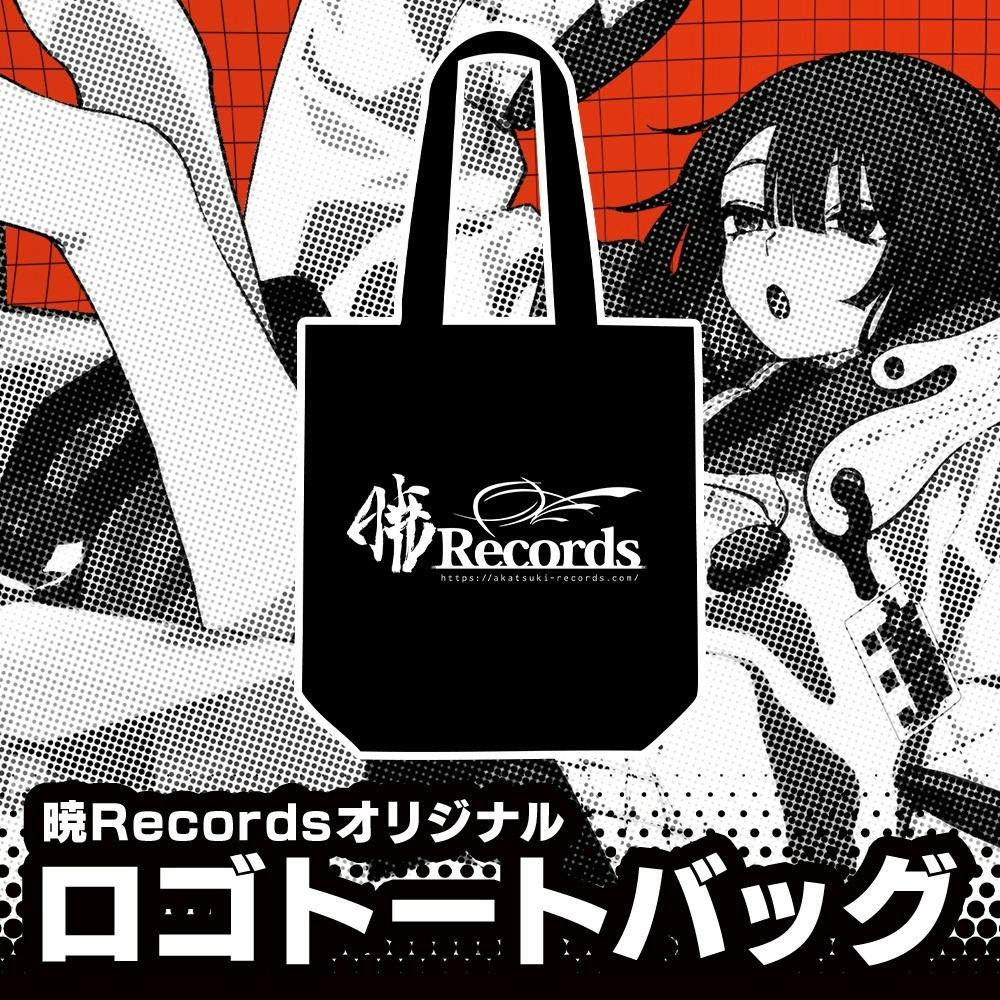 Black tote bag with the 暁Records logo printed in white on the front, shown centered on an illustrated background.