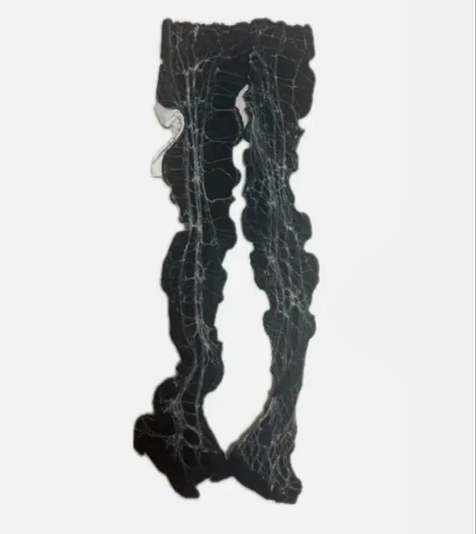Black arm sleeves with a white spiderweb pattern shown flat on a white background.