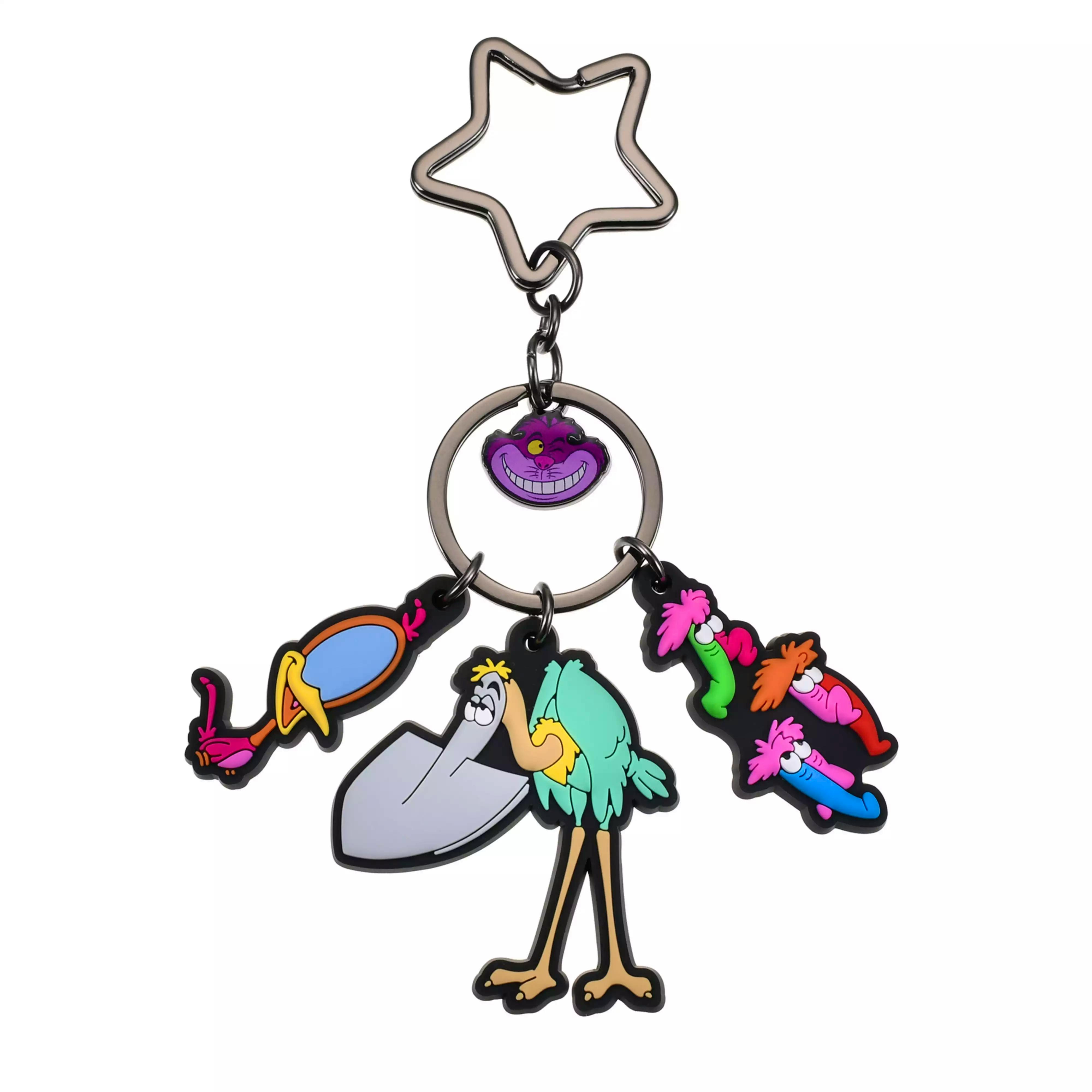 Close-up of the Alice in Wonderland rubber keychain showing a star-shaped top ring, metal split rings, and multiple colorful rubber character charms including a purple grinning cat.