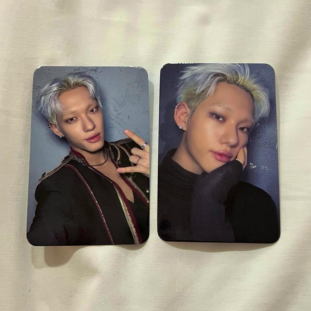 Two photocard fronts from the RISE UP set showing portrait photos of the artist laid side by side on a light background.