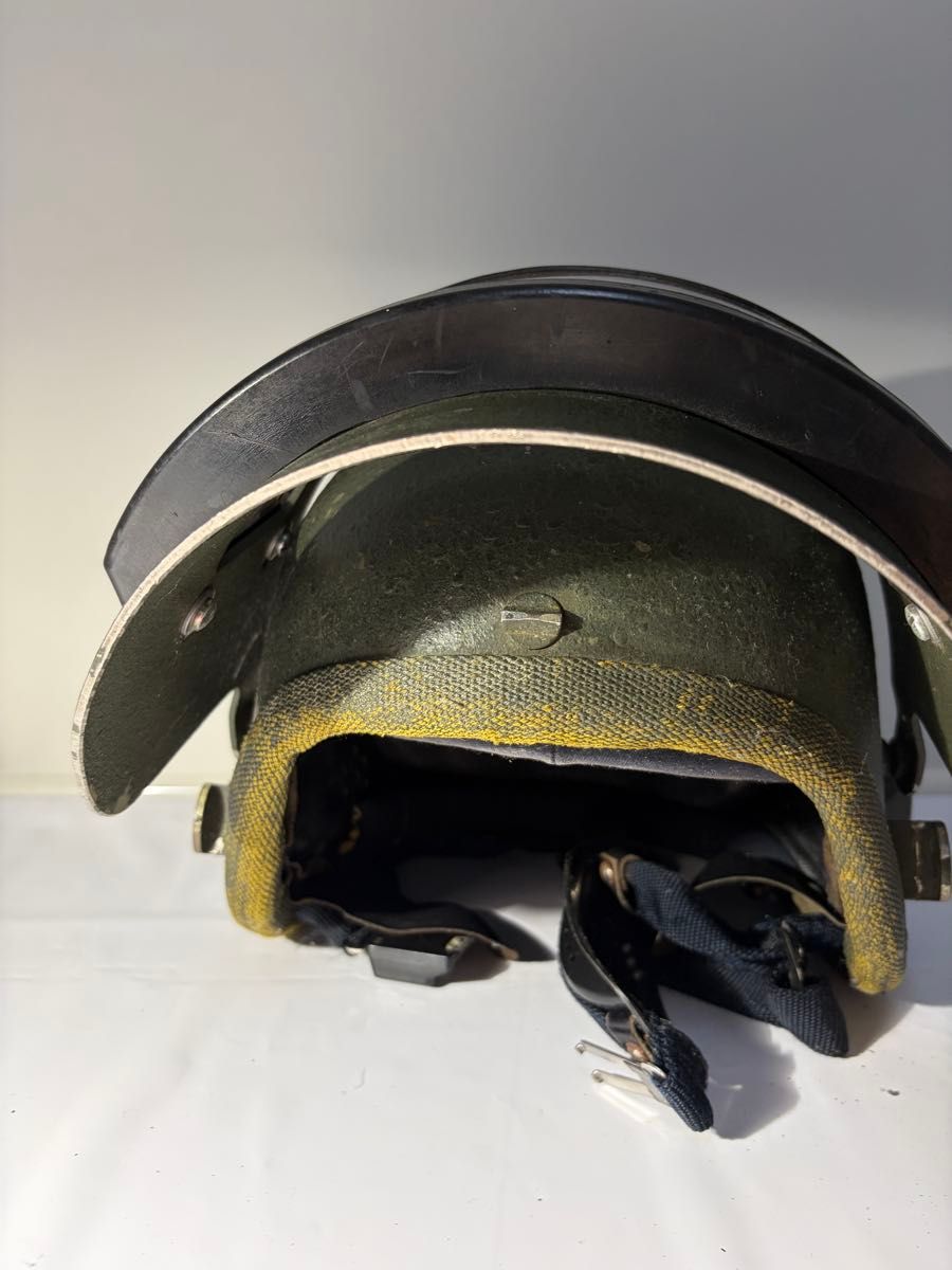 Front view of the Altyn helmet showing the outer shell, visor, and chin straps on a white background.