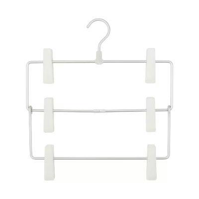 An aluminum hanger for pants and skirts with three horizontal bars and six white clips.