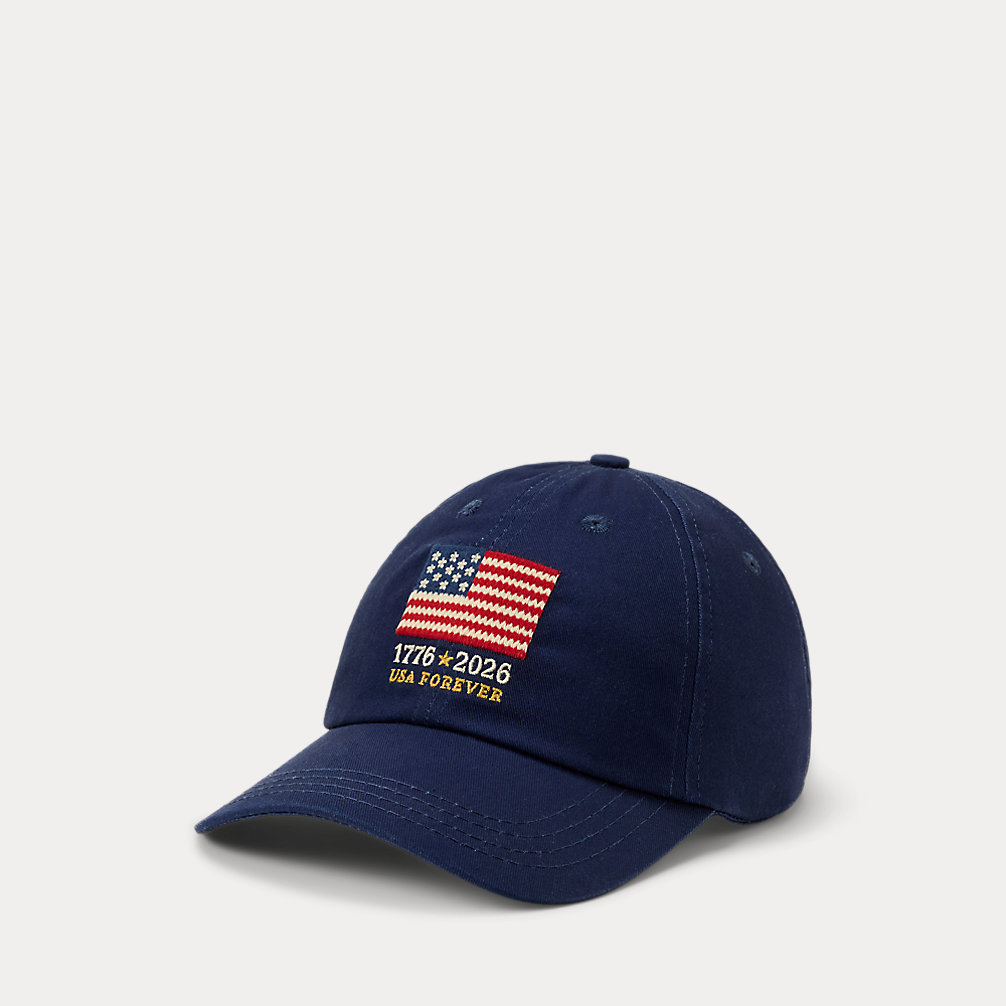 Navy cotton baseball cap with an embroidered American flag and '1776-2026 USA FOREVER' text on the front.