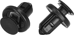 Two black plastic automotive rivets (car fastener clips) on a white background.