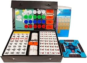 Open mahjong set in a box displaying rows of white mahjong tiles, colored scoring chips, trays, and packaging.