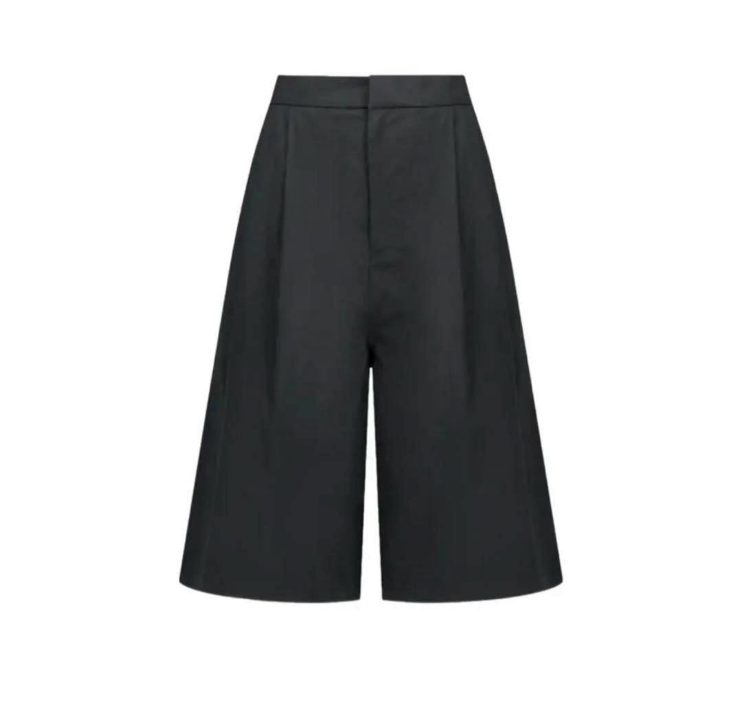 Front view of the men's two-tuck wide shorts in black on a white background.