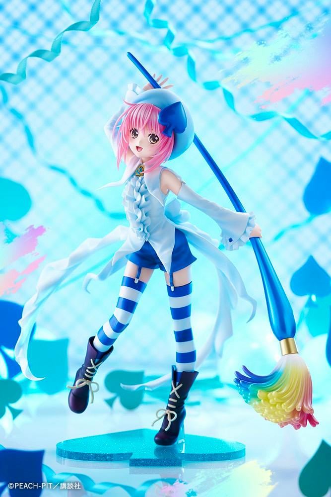Figure of アミュレットスペード with pink hair wearing a white and blue outfit, holding a large colorful brush and posed on a blue display base.