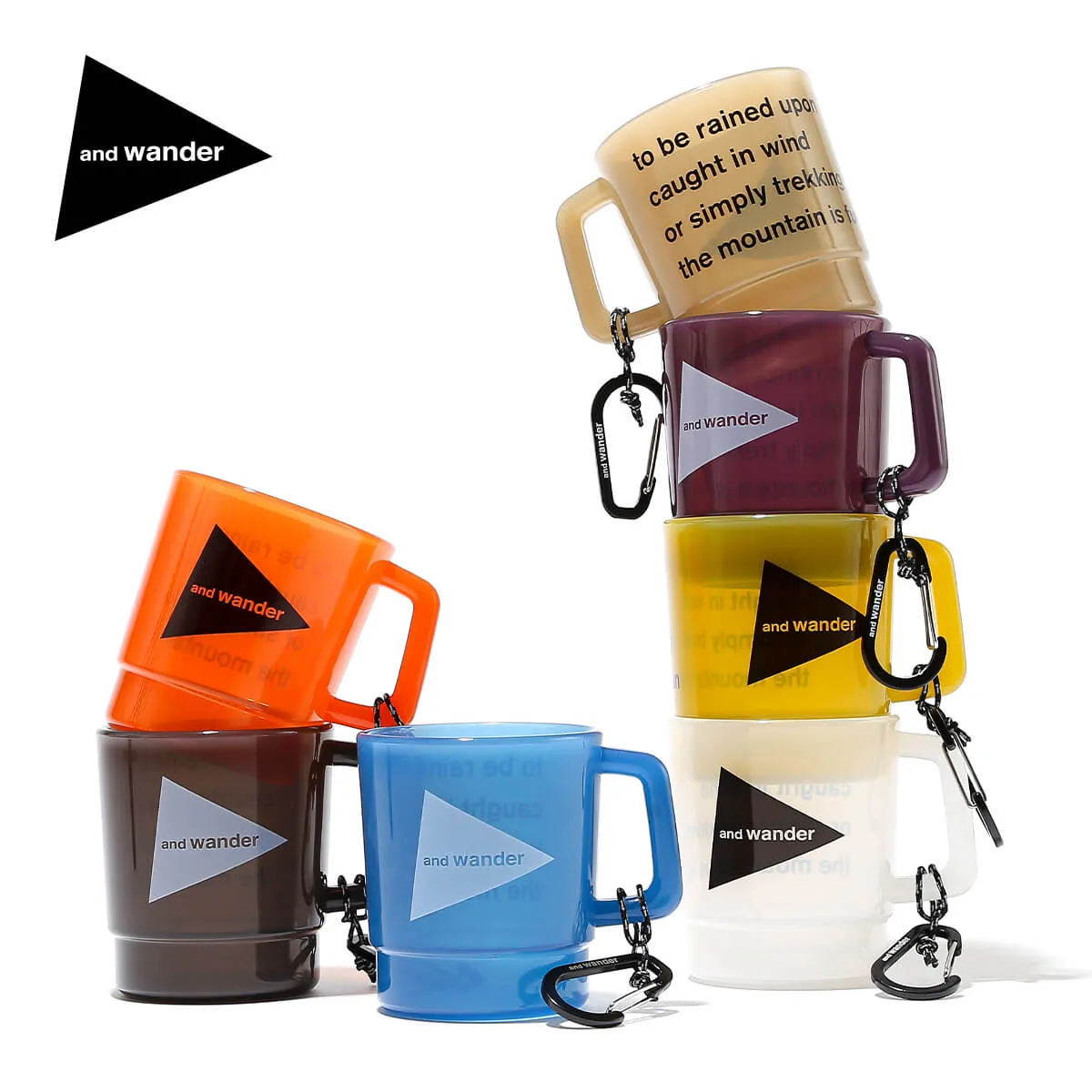 Several colored and wander PP plastic mugs with attached carabiners arranged on a white background.