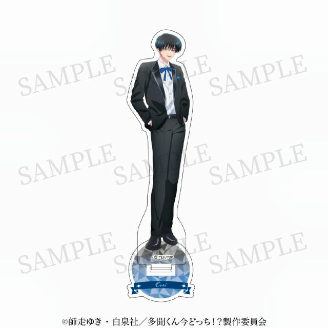 Full-body acrylic stand of character 坂口桜利 from the TV anime, wearing a black suit and standing on a patterned round base, with a visible "SAMPLE" watermark.