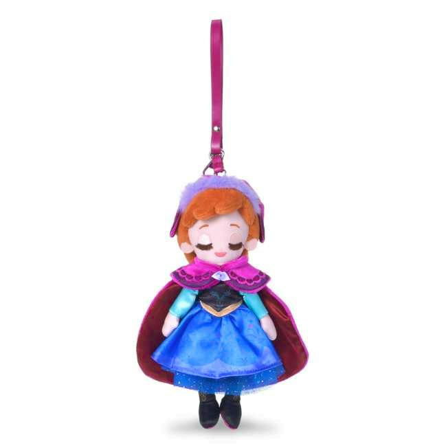 Plush keychain of Anna from Frozen wearing a blue dress and magenta cape, shown hanging from a pink strap.