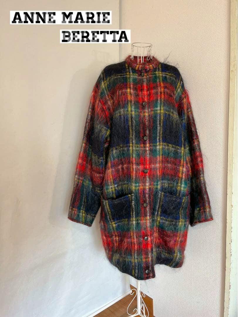 Multicolored plaid mohair-wool women's coat displayed on a dress form.