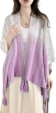Model wearing an open-front ombre knit shawl with tassels draped over her shoulders.