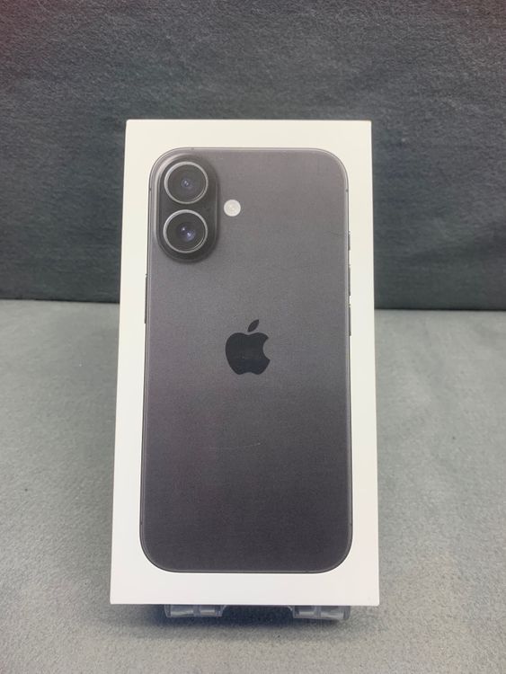 Sealed retail box showing the front artwork of a black iPhone 16.
