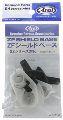 Arai-branded blister pack containing ZF Shield Base repair parts, showing white and black plastic components and printed label.