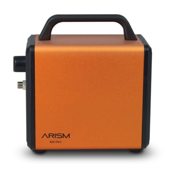 Front view of the orange ARISM-MINI-EO air brush compressor showing the handle, logo, and side fittings.