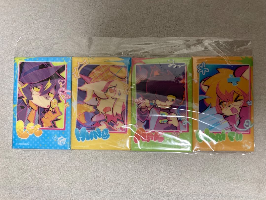Four rectangular Arknights-themed fridge magnets with colorful chibi character art, packaged together in a clear plastic wrapper on a gray surface.
