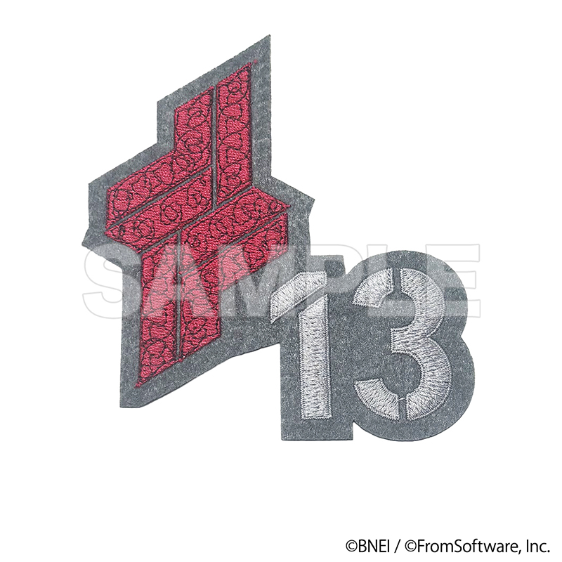 Embroidered fabric patch showing a red geometric emblem and the number 13 on a white background.