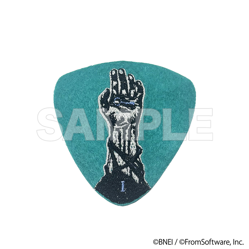 Teal triangular guitar pick featuring a gray hand design with a 'SAMPLE' watermark.