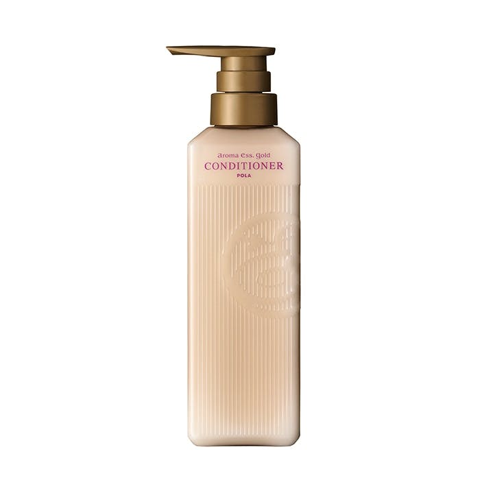 A beige pump bottle of the conditioner アロマエッセゴールド コンディショナー N shown on a white background.