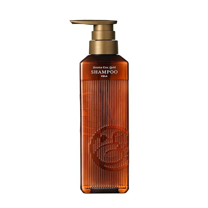 Front view of a brown pump bottle of the アロマエッセゴールド シャンプー N shampoo on a white background.