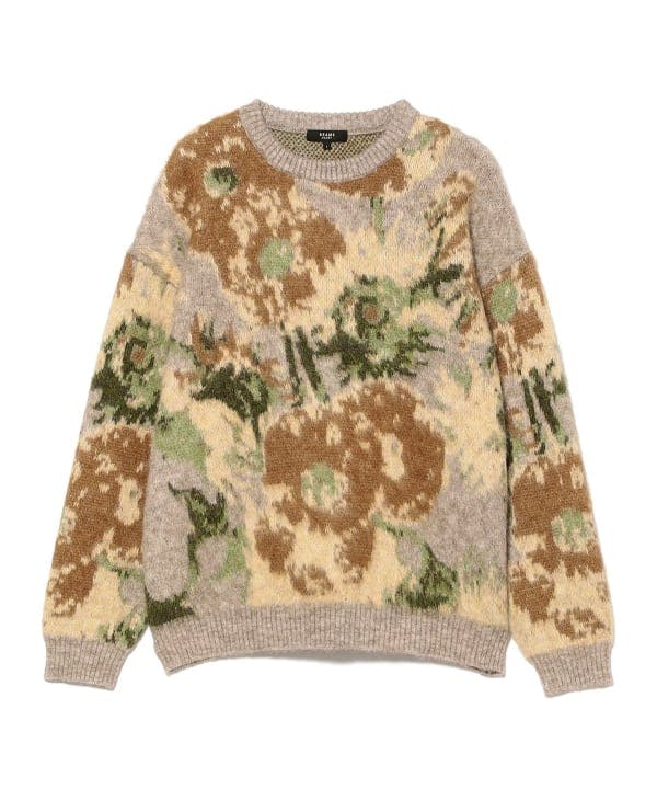 A crewneck shaggy knit sweater with brown, green, and beige patterned design laid flat on a white background.