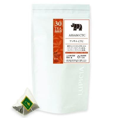 A white pouch of Assam CTC black tea labeled "30 TEA BAGS" with a pyramid tea bag shown beside it.