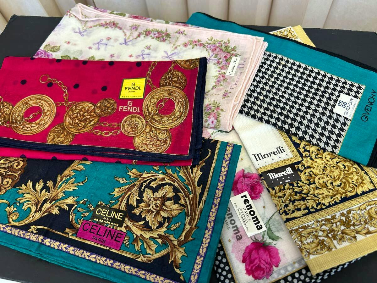 Several folded branded handkerchiefs arranged on a surface, with a CELINE handkerchief visible in the foreground.